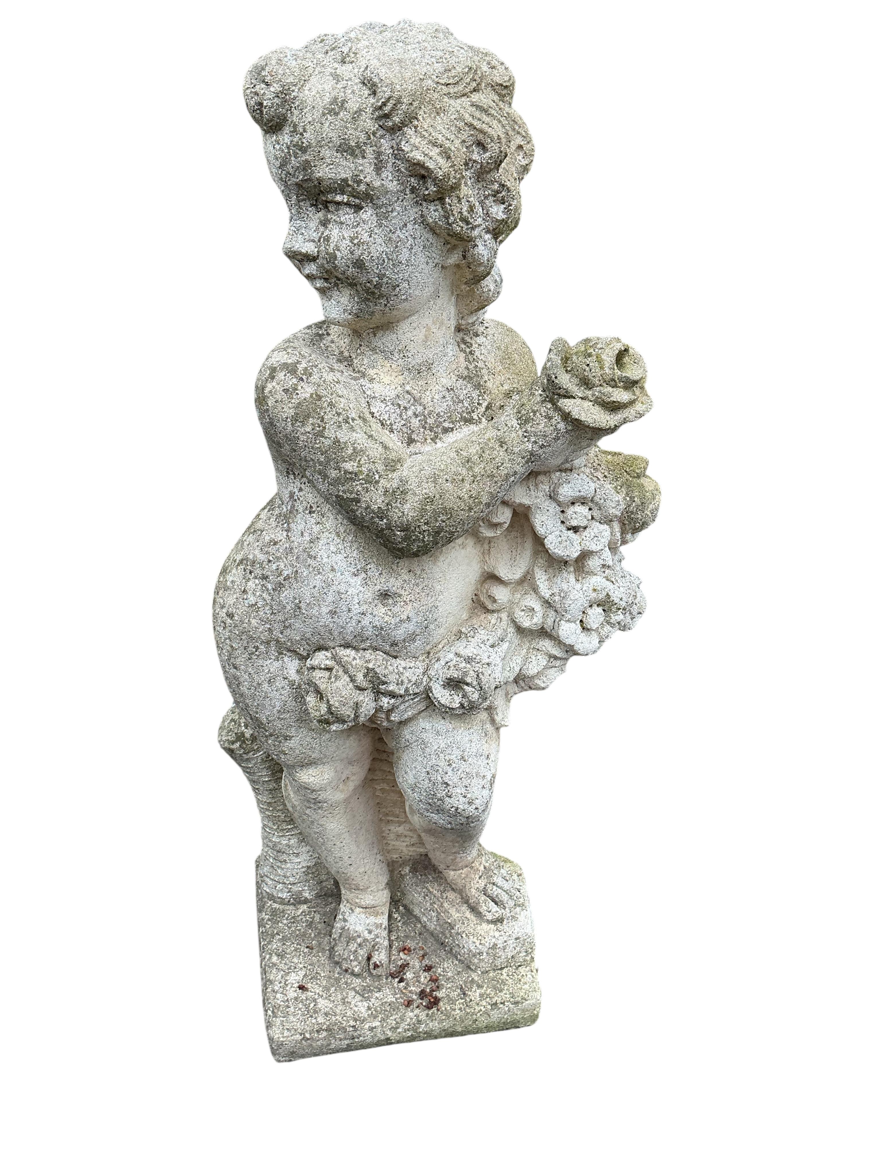A pair of reconstituted stone cherub garden ornaments, height 80cm